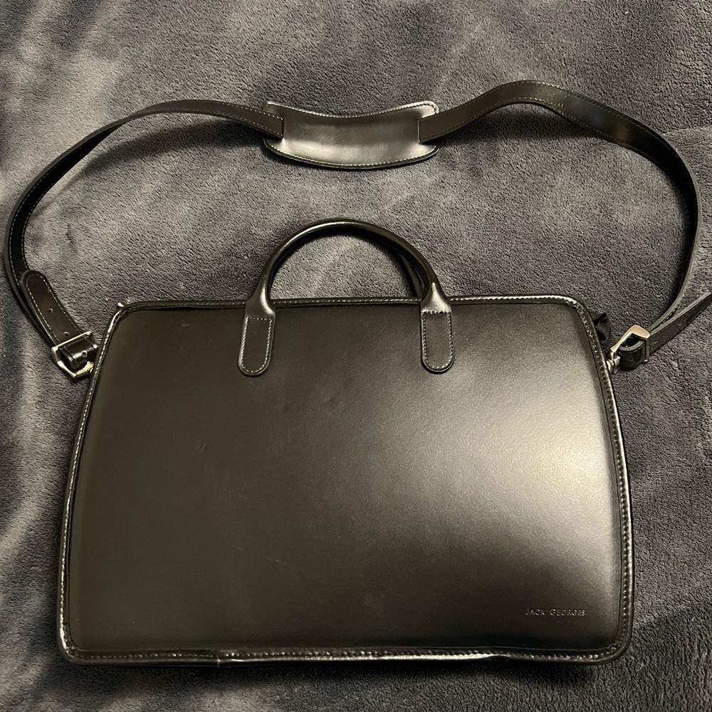 Sleek black leather Jack George’s attaché case. Perfect for work.